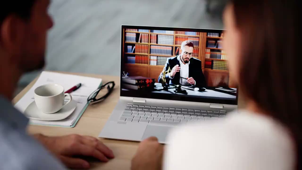 Couple meeting with an immigration lawyer over a video call